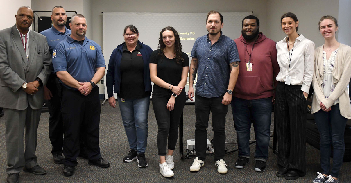 SU Police Department and Governor's Office of Crime Prevention, Youth and Victim Services representatives with SUPD simulator